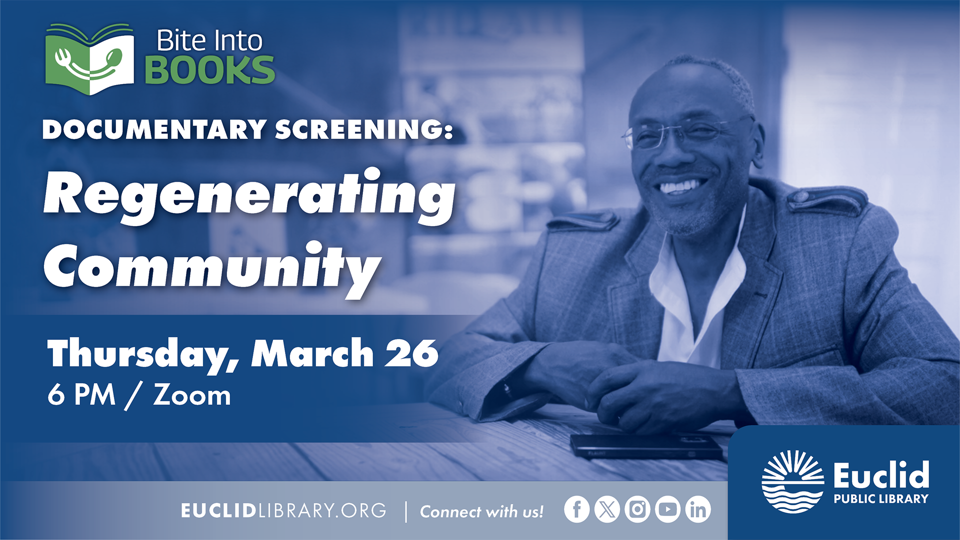 Smiling man in suit being interviewed in documentary