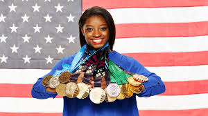 Simone Biles showing off all of her Olympic medals