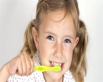 Girl brushing teeth