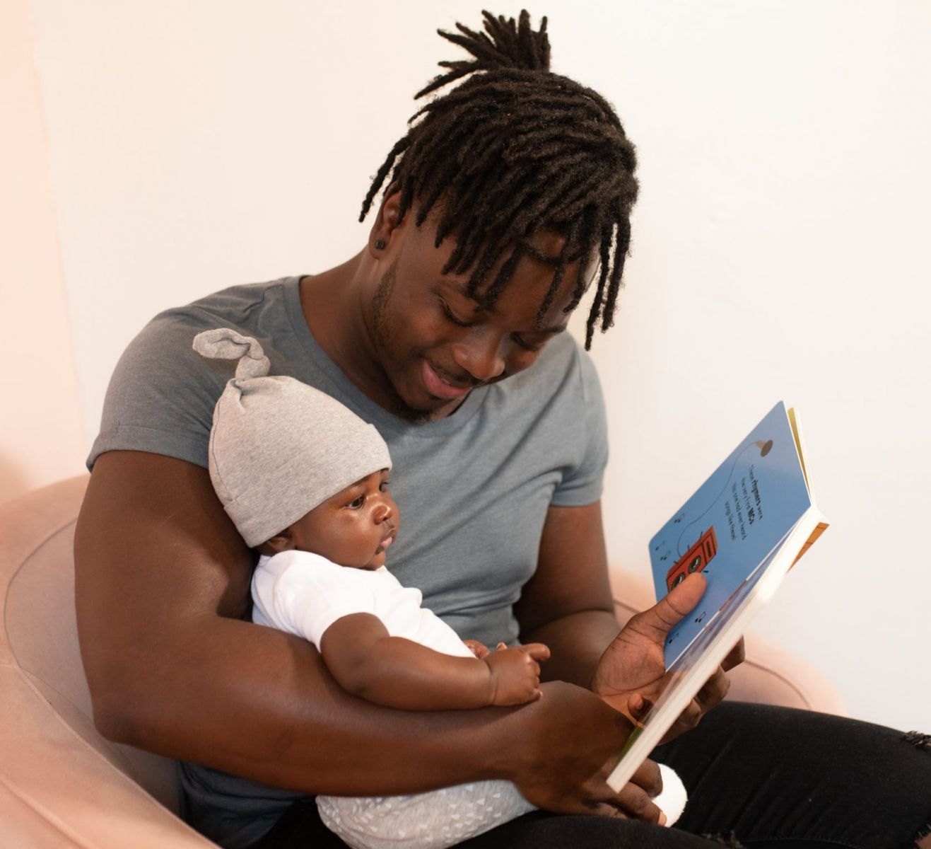 Photo of father reading to his child