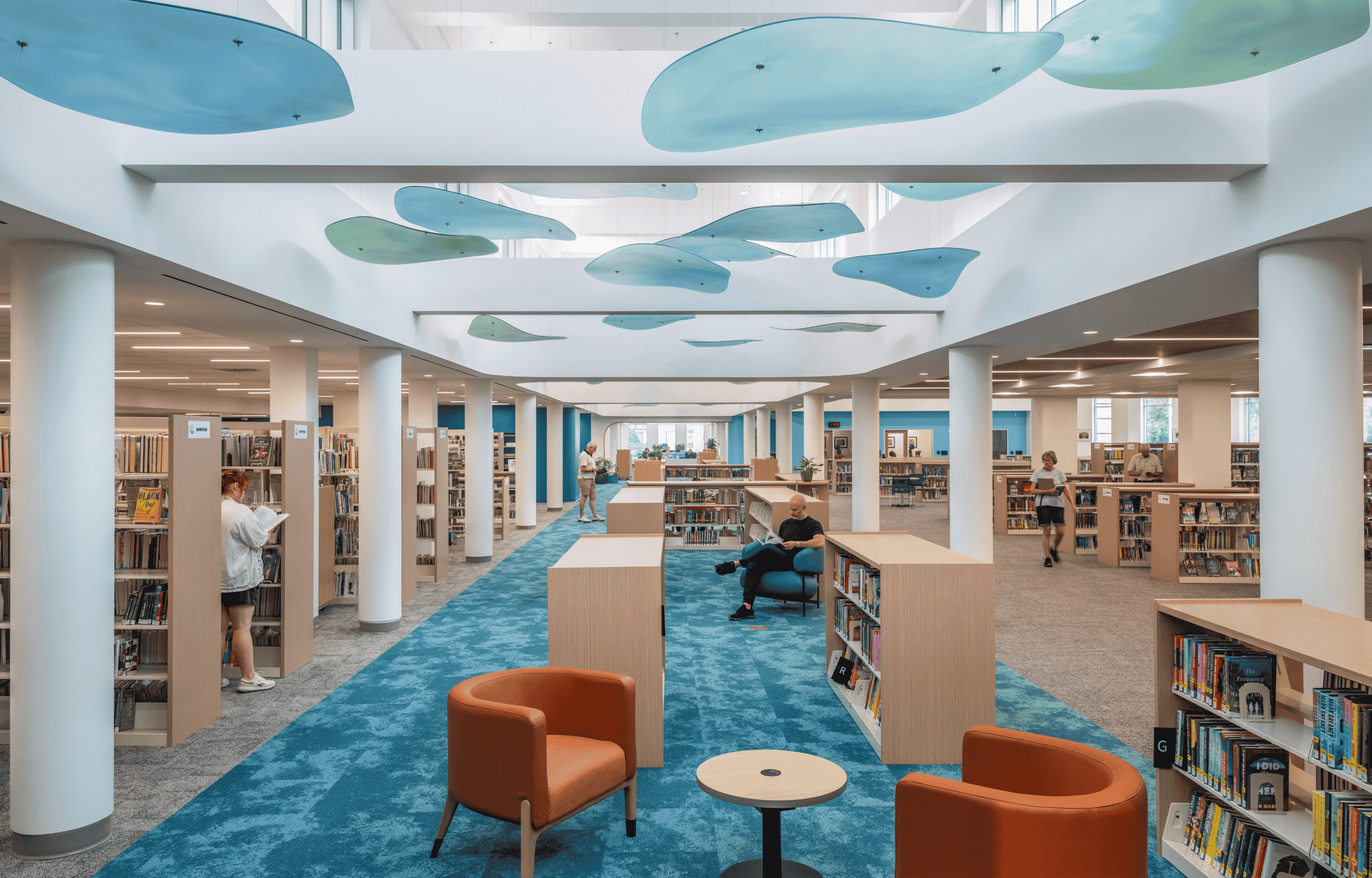 Euclid Public Library's spine with lily pads on the ceiling with a few individuals visible in the Library