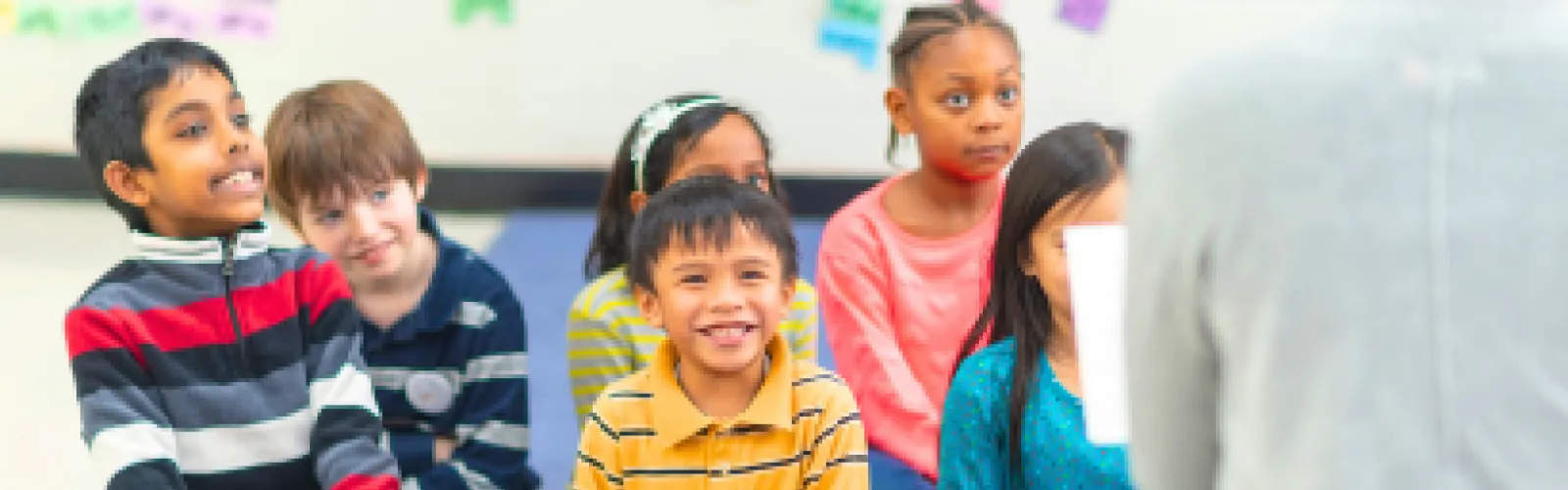 Happy children listening to a story