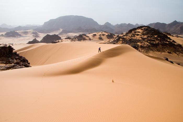 Crossing soft sand dunes in Tadrart Acacus a desert area in western Libya, part of the Sahara.