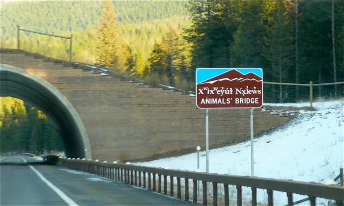 Animal crossing on route 93 near Evaro, Montana on the Flathead Indian Reservation. Sign in English and Salish languages.